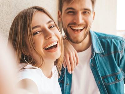 Happy patient showing results after cosmetic teeth whitening in Canberra