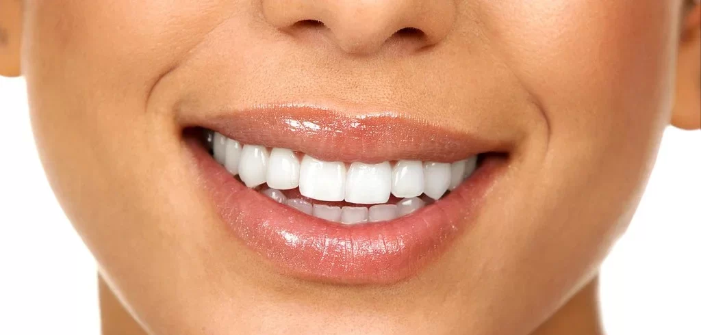 Smiling teeth between Lips.